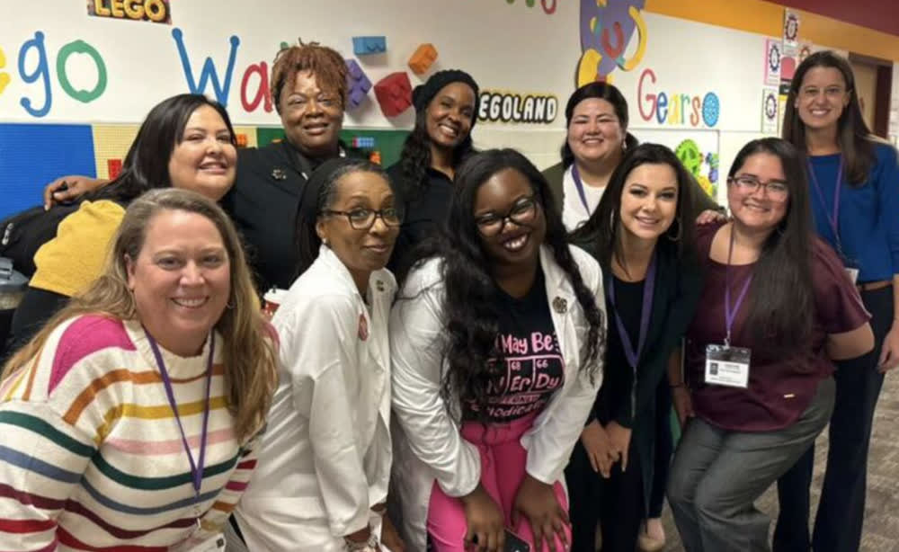 Horn and Del Valle educators on a STEM school visit